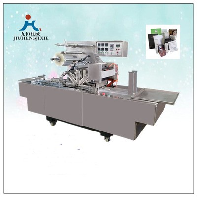 廠家直銷九恒牌JZ-350型轉(zhuǎn)塔式奶粉盒薄膜三維包裝機(jī)煙包機(jī)