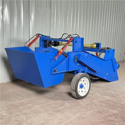 農(nóng)田開荒耕地?fù)焓瘷C(jī)器 拖拉機(jī)帶的有石頭的收集箱